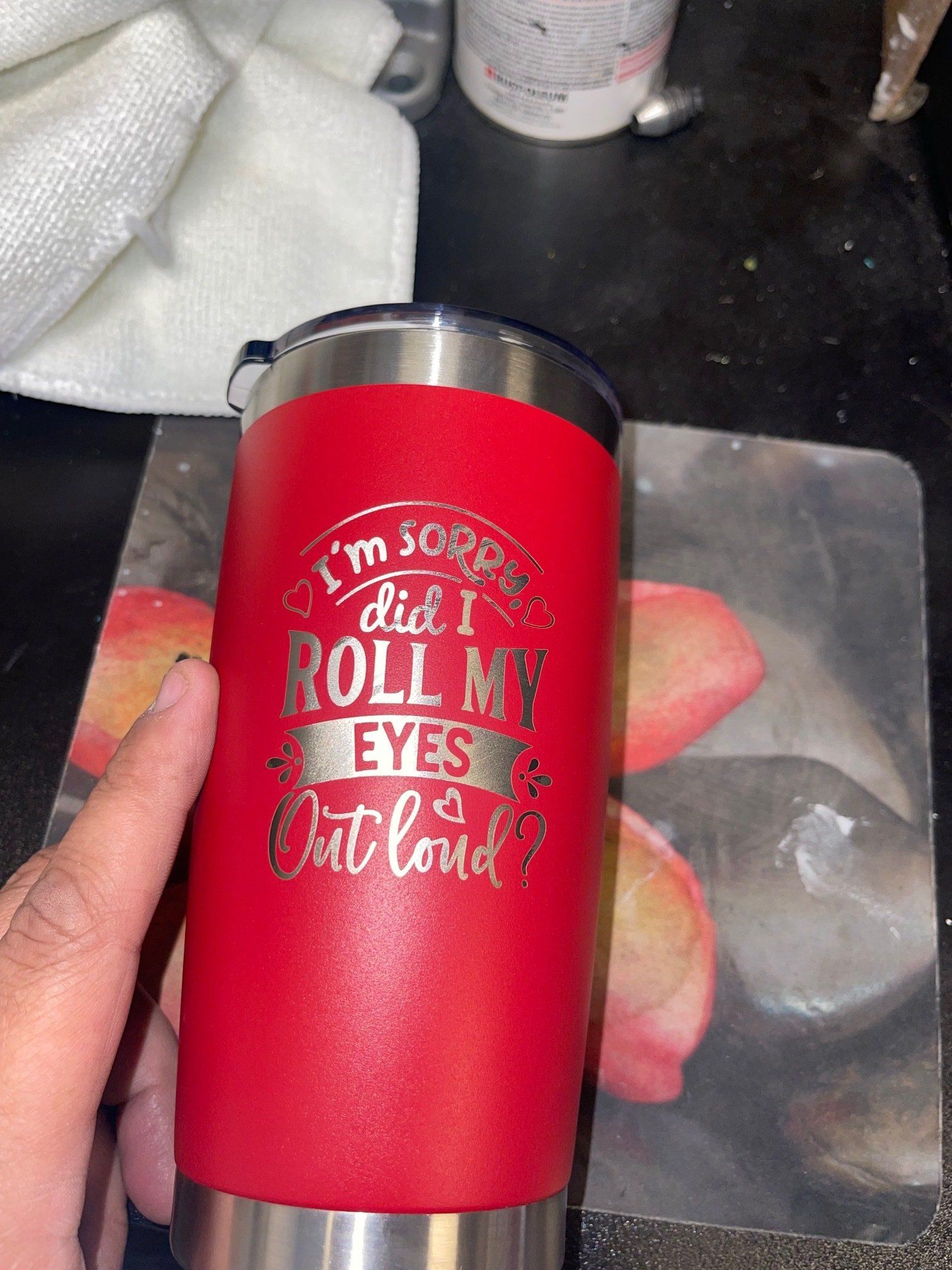 A person is holding a red tumbler that says `` i 'm sorry did i roll my eyes out loud ''