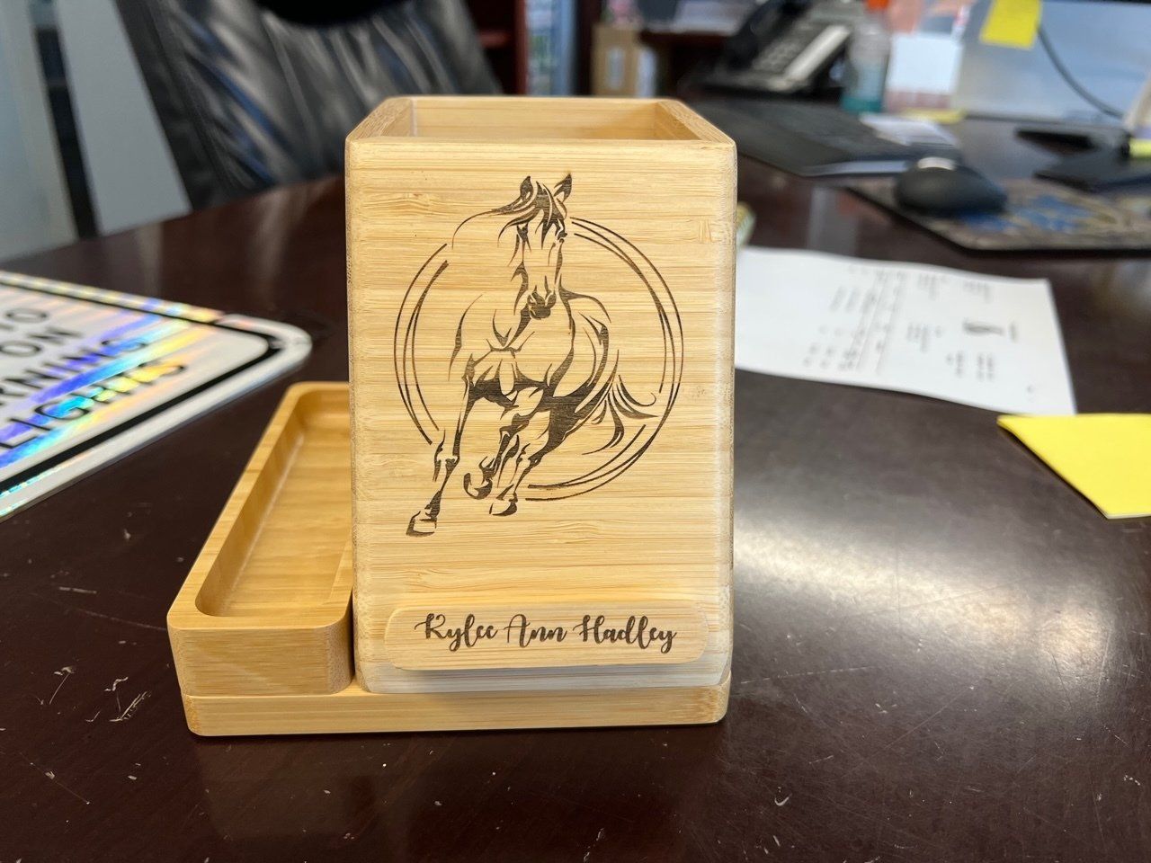 A wooden box with a picture of a horse on it