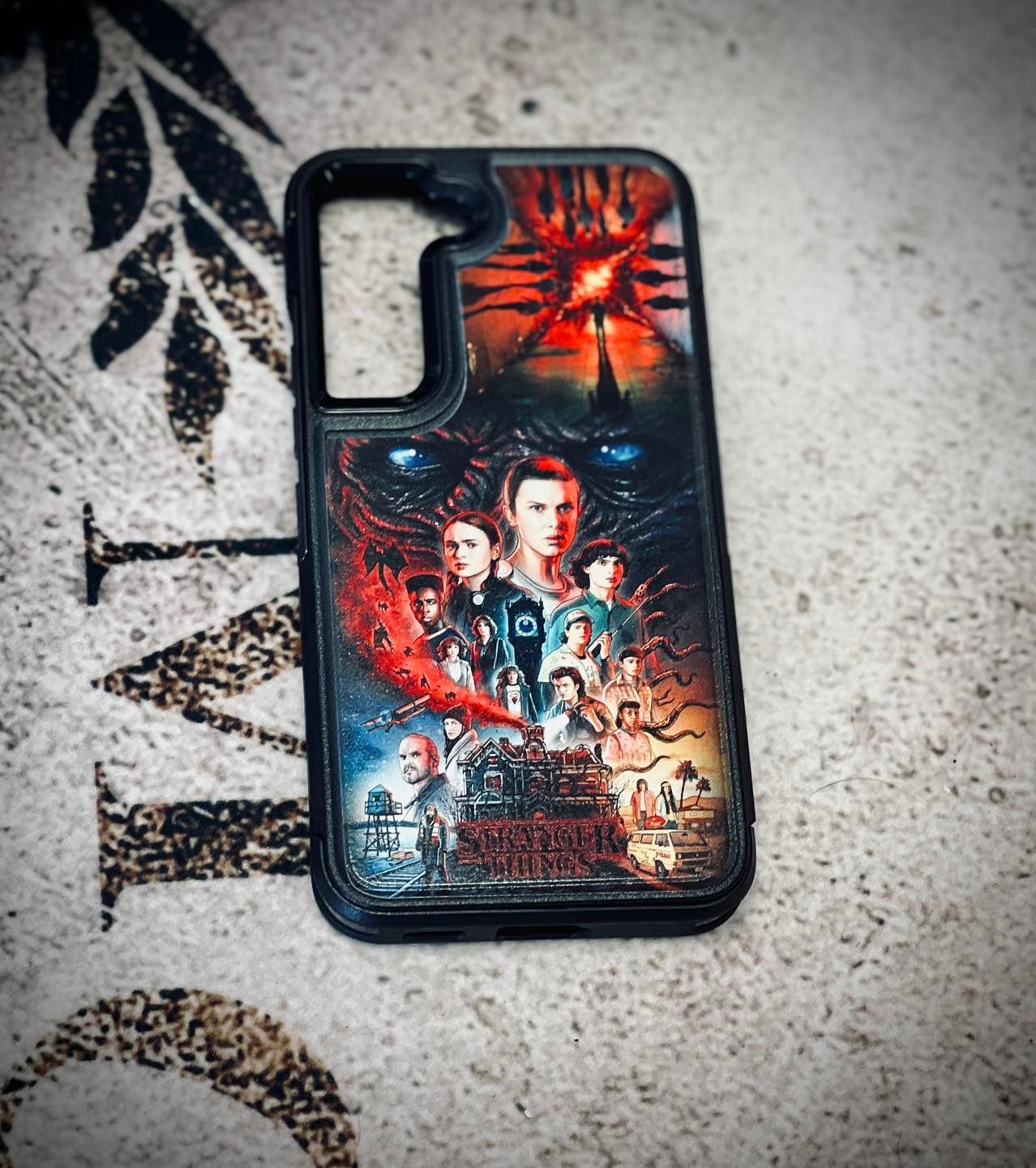 A phone case with a picture of stranger things on it