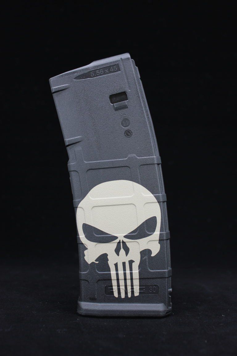 A black magazine with a punisher skull on it.