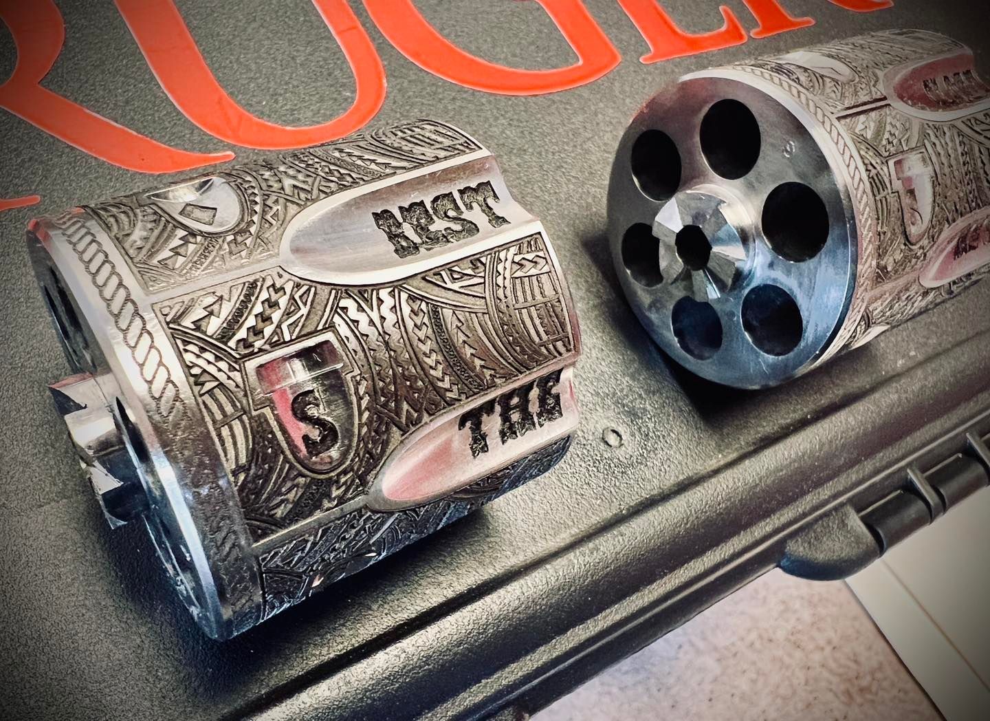A close up of a revolver cylinder that says ' smith & wesson ' on it