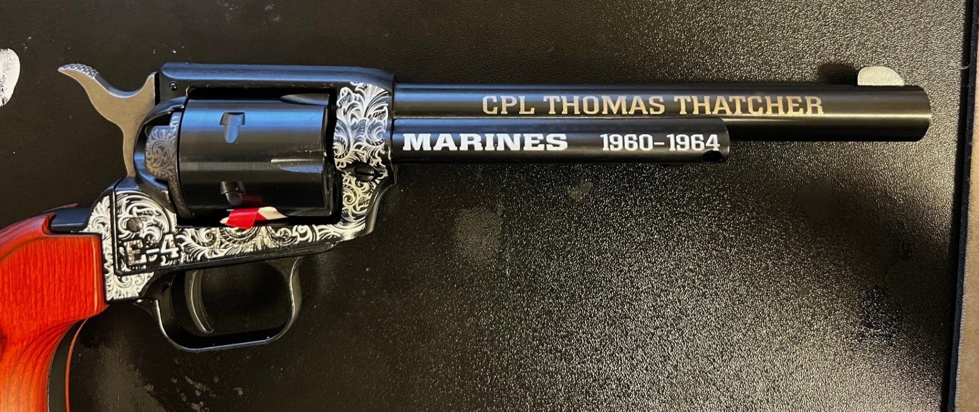 A revolver with the name gel thomas thatcher on it