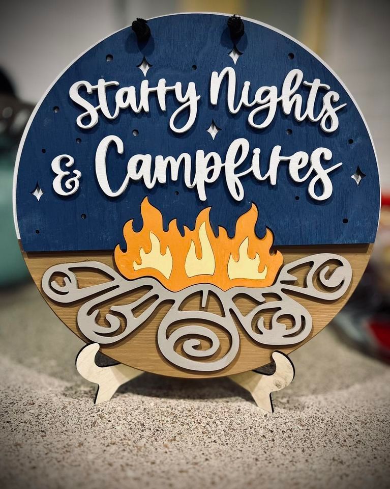 A sign that says starry nights and campfires on it