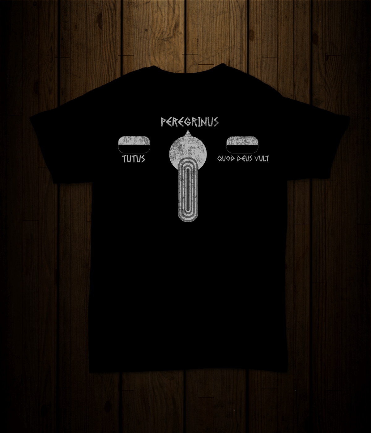 A black t-shirt is sitting on a wooden table.