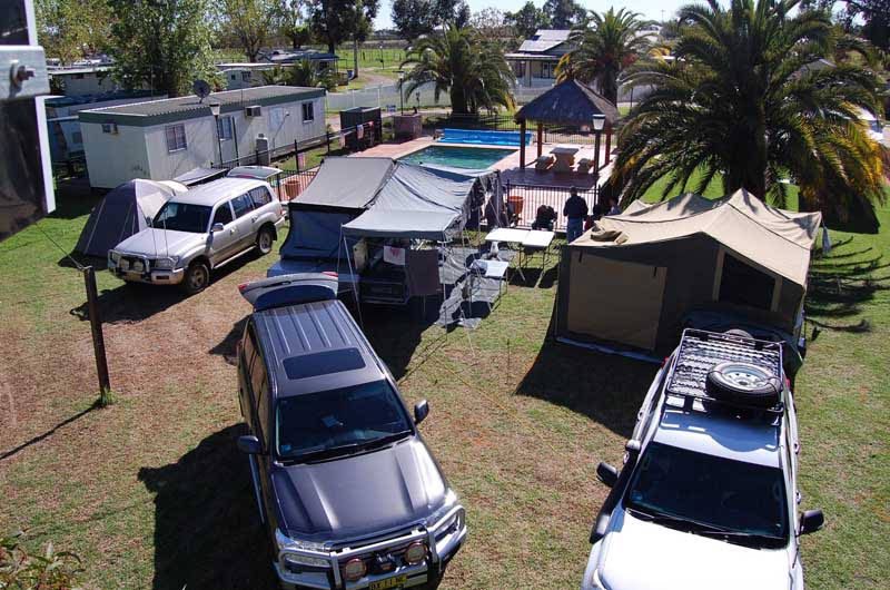 cars and tents in caravan park in carlwaa