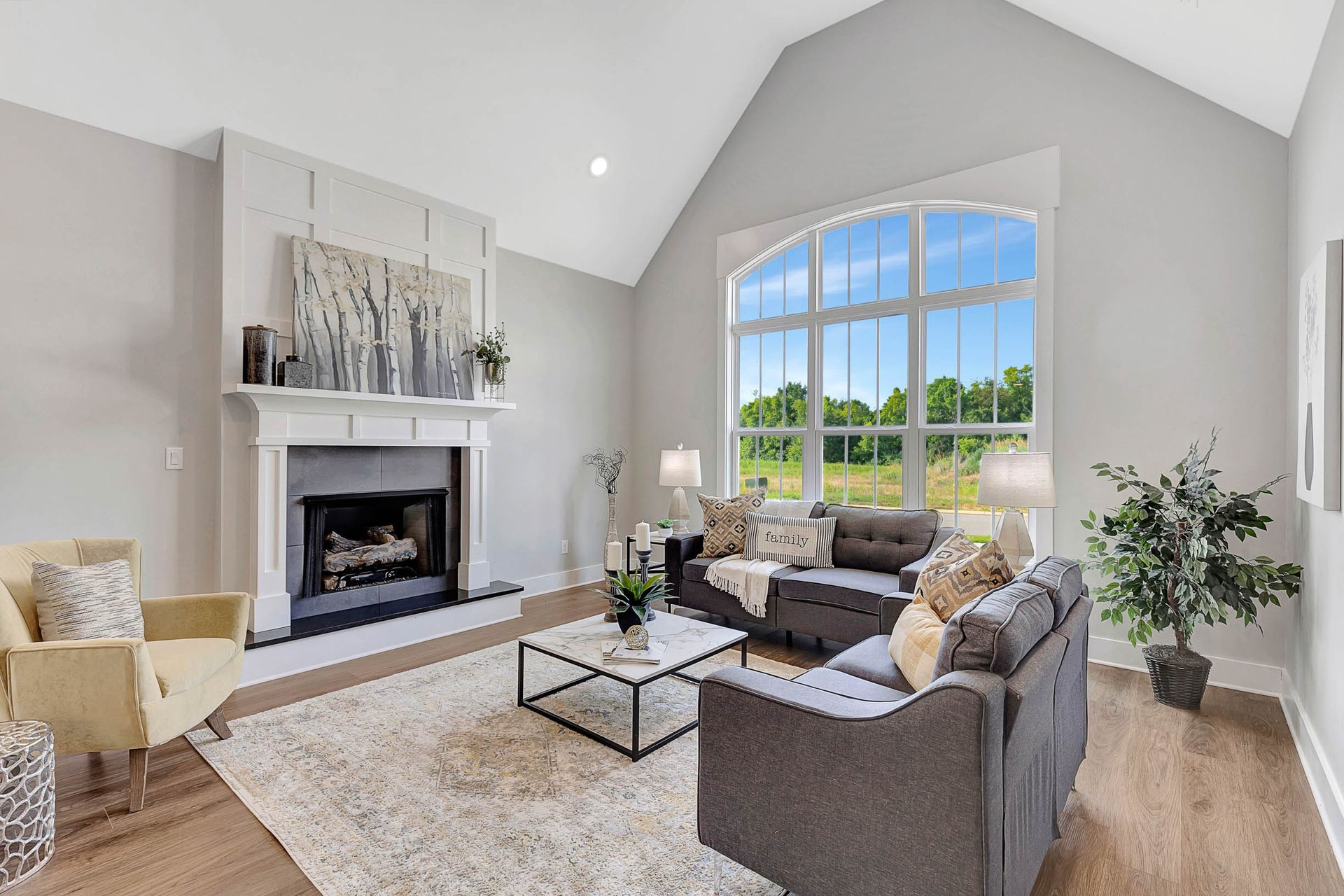A living room filled with furniture and a fireplace.