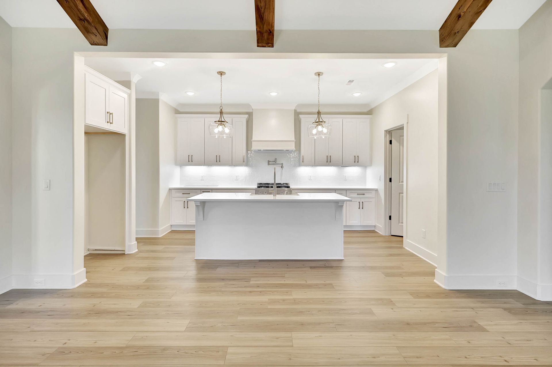 There is a large island in the middle of the kitchen.