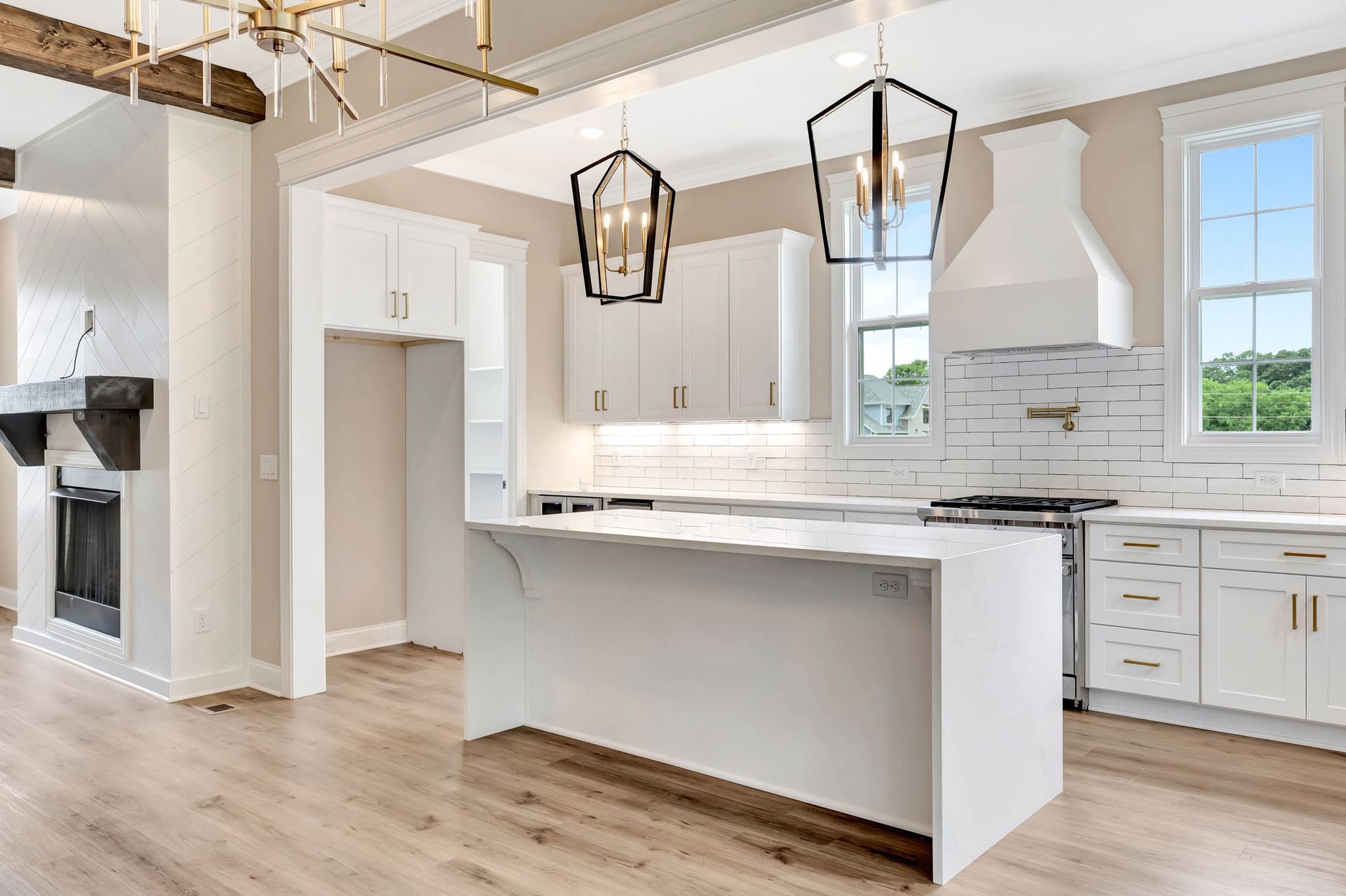 There is a large island in the middle of the kitchen.