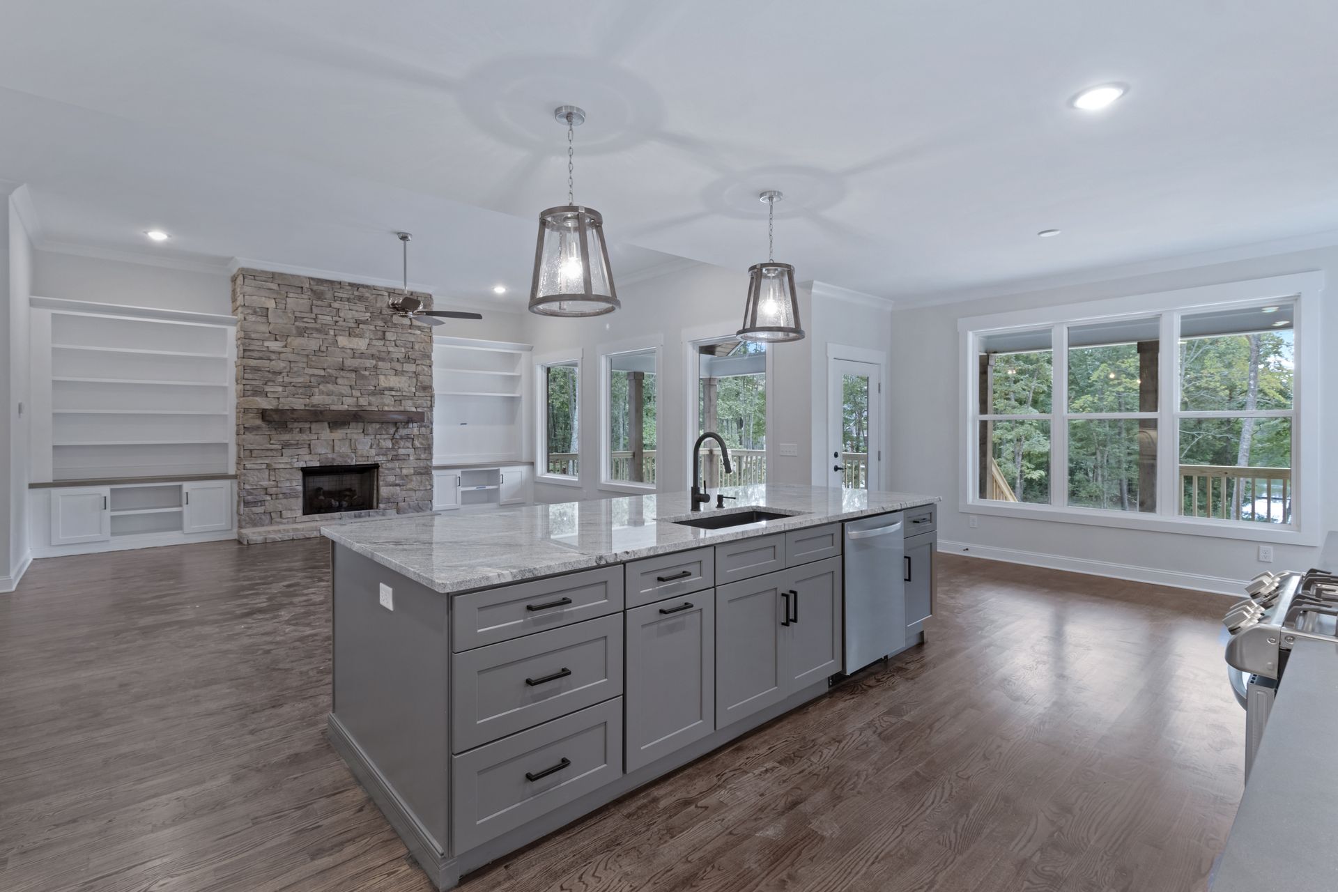 there is a large island in the middle of the kitchen .