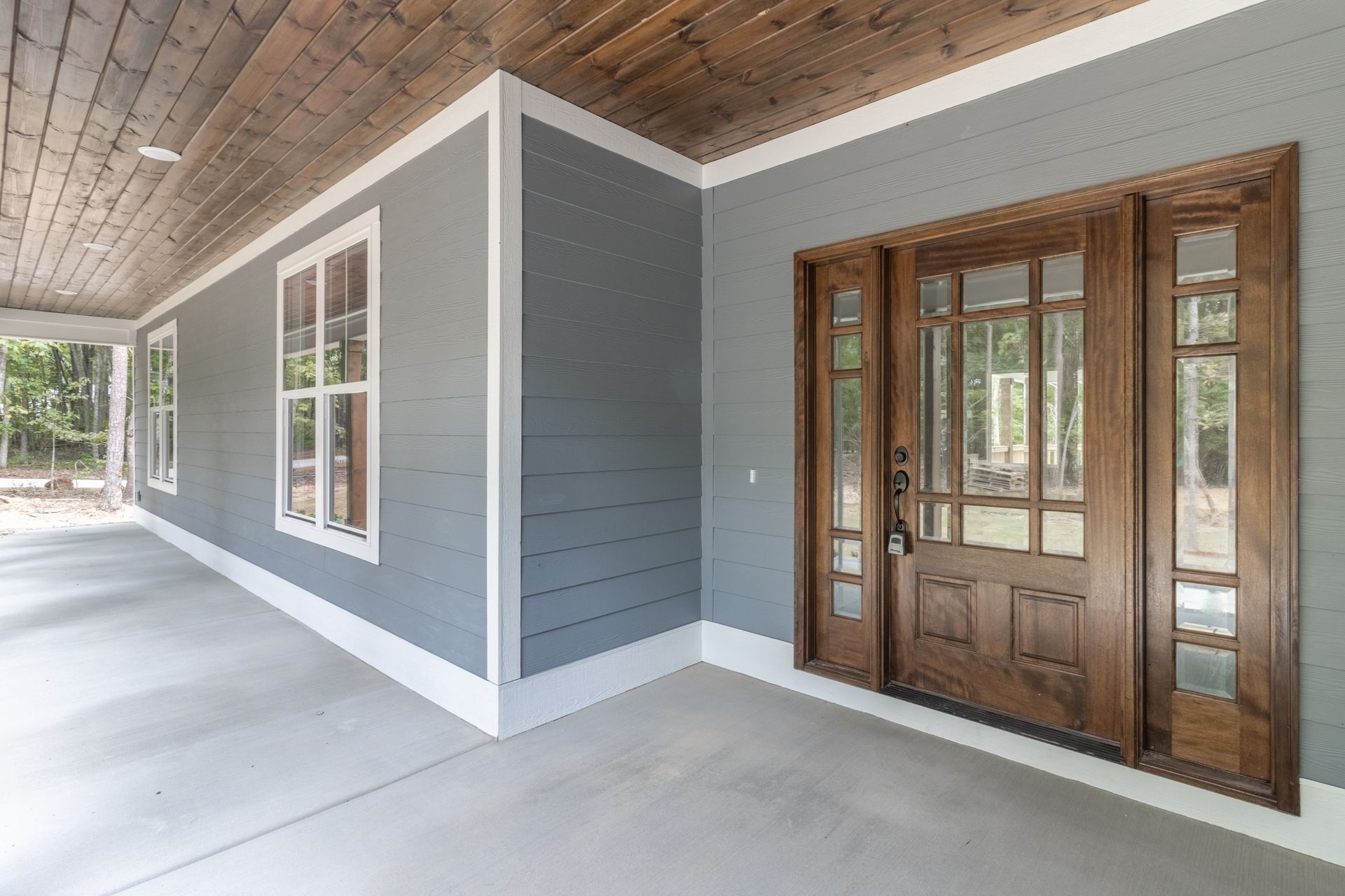 a house with a porch and a wooden door