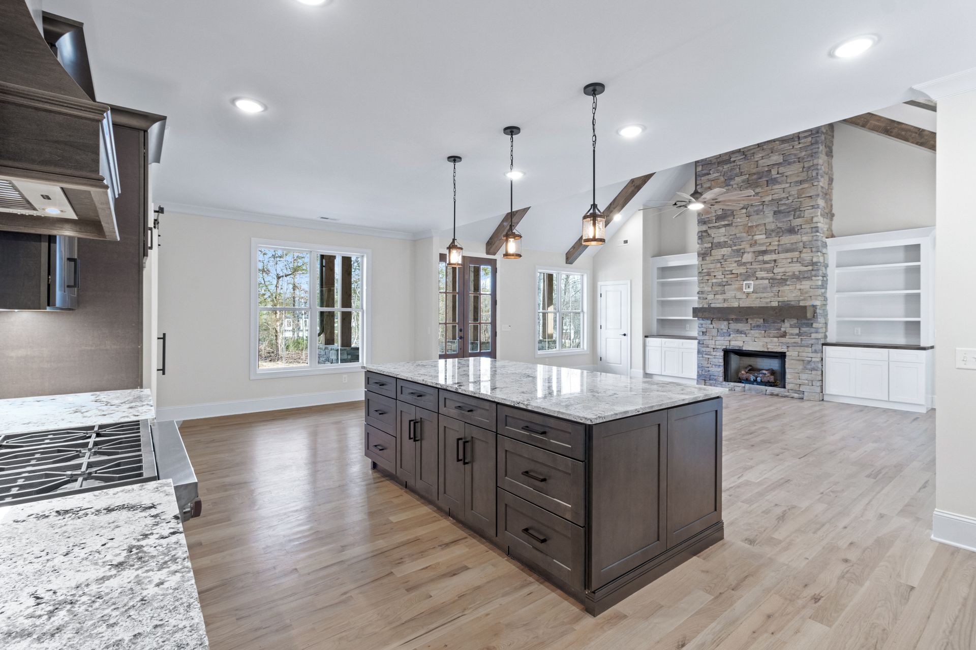 there is a large island in the middle of the kitchen .