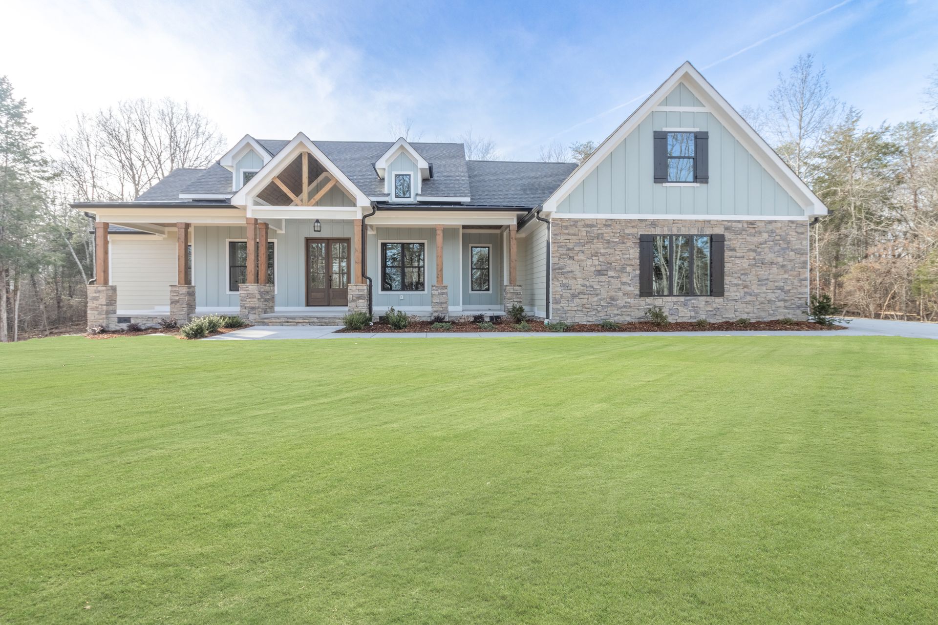 a large house with a large lawn in front of it .