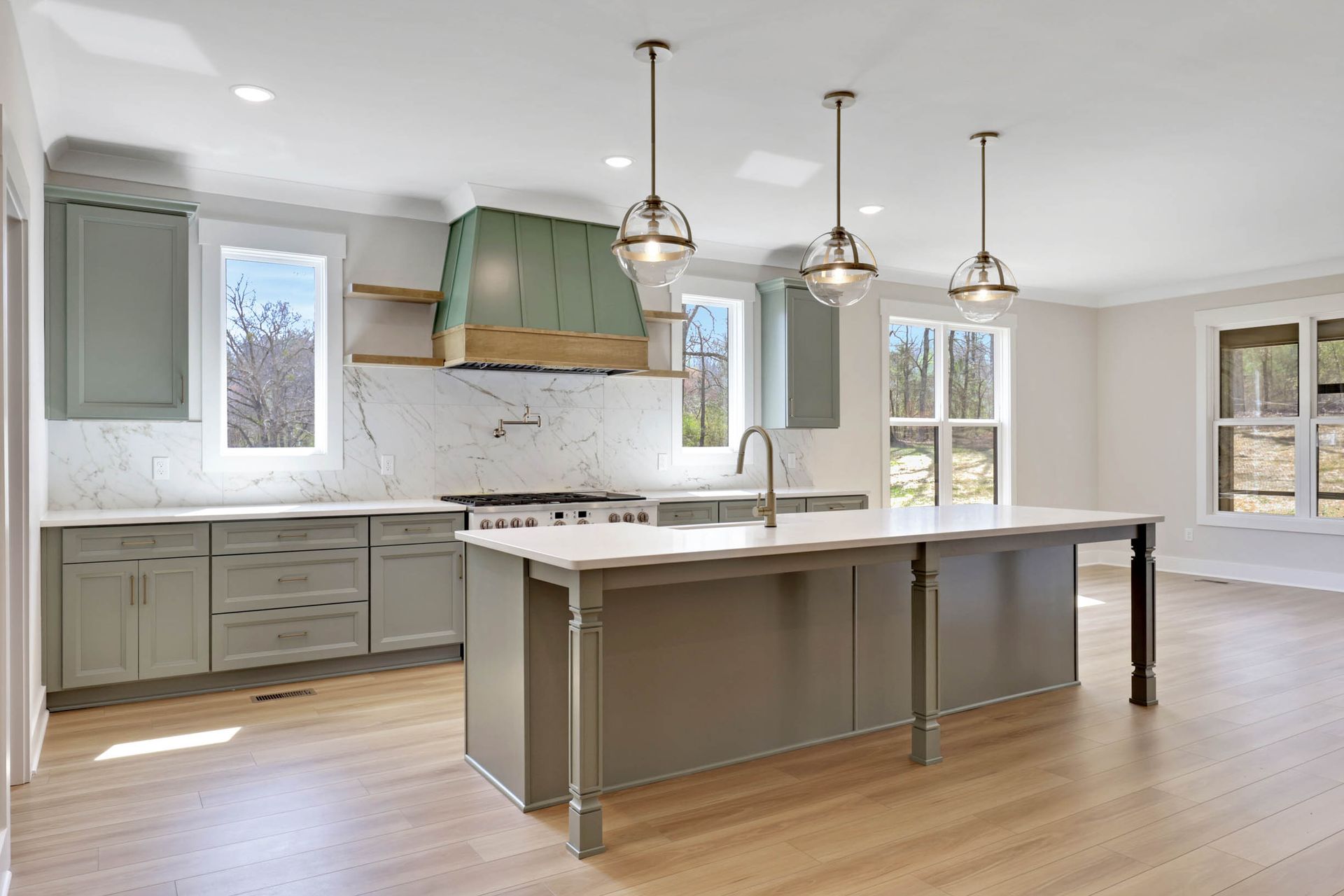 There is a large island in the middle of the kitchen.