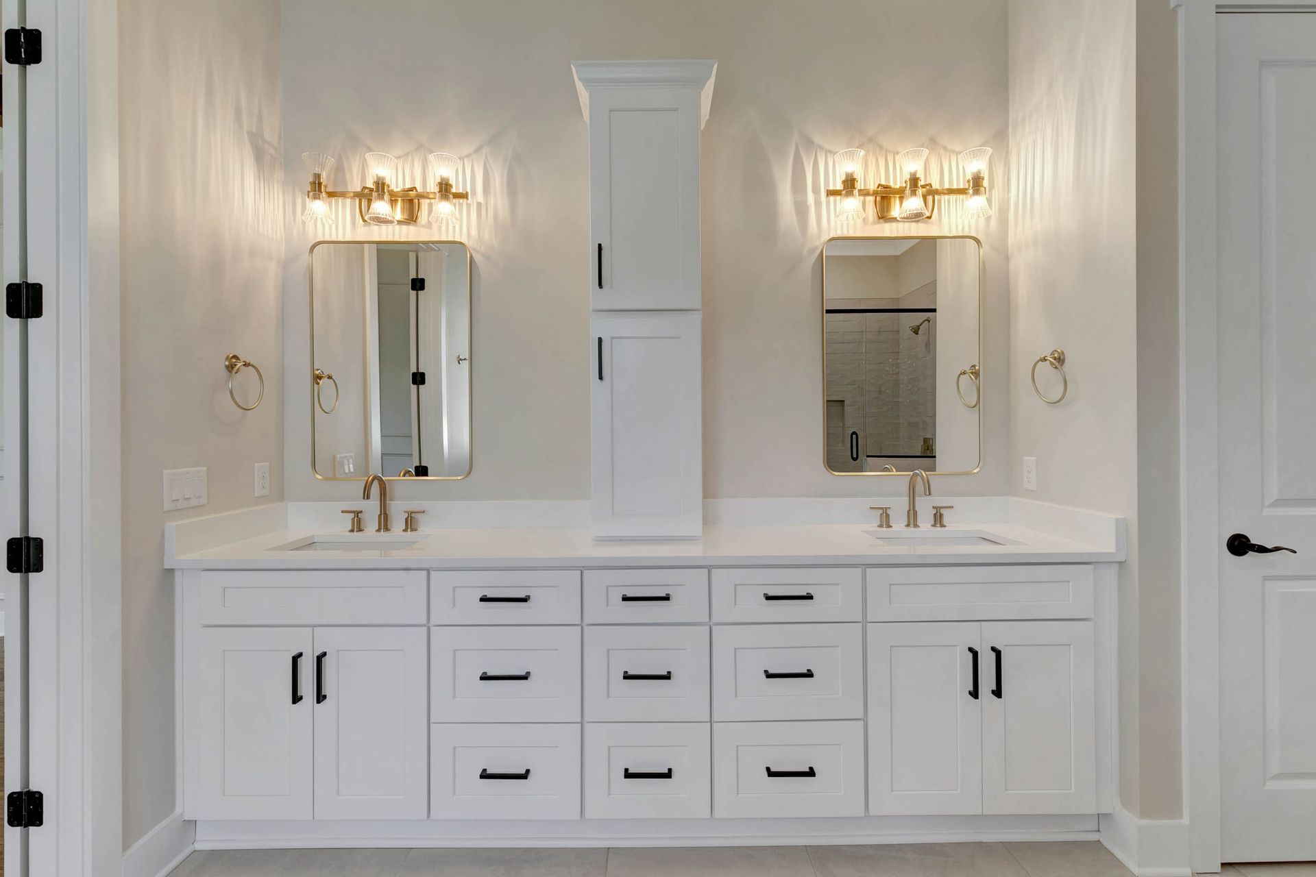 A bathroom with two sinks and two mirrors.