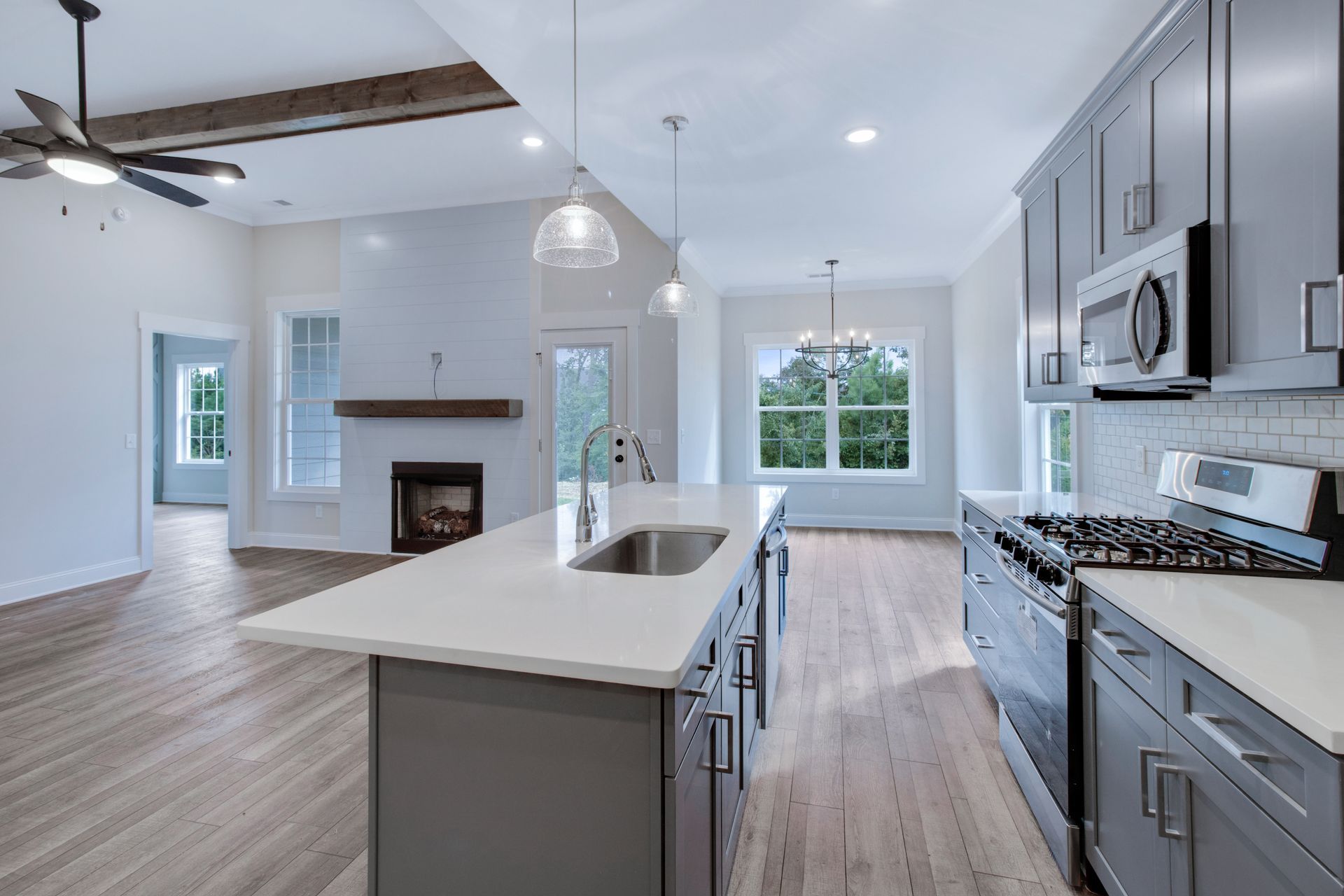 a kitchen with a large island in the middle of the room .