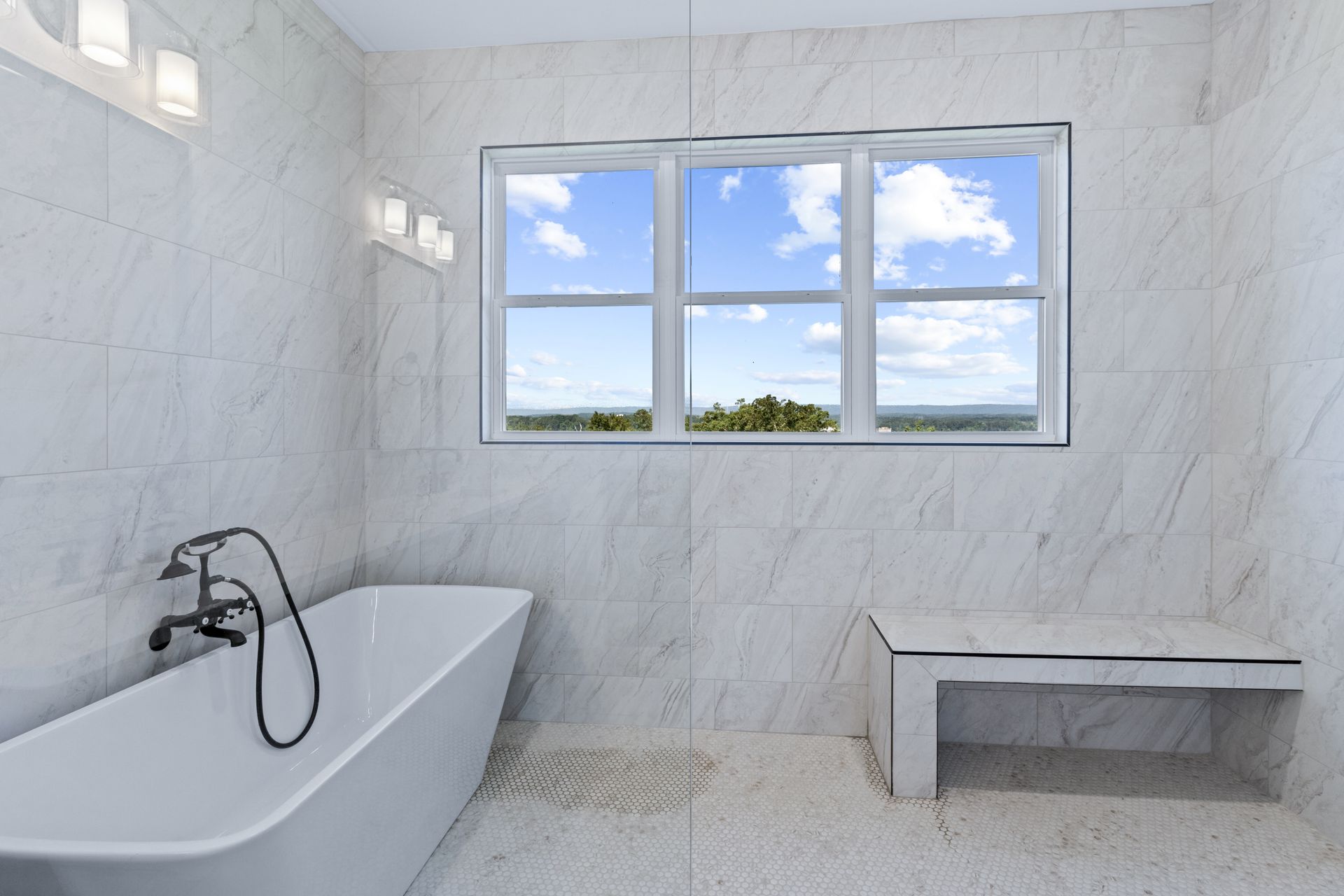 a bathroom with a bathtub and a window