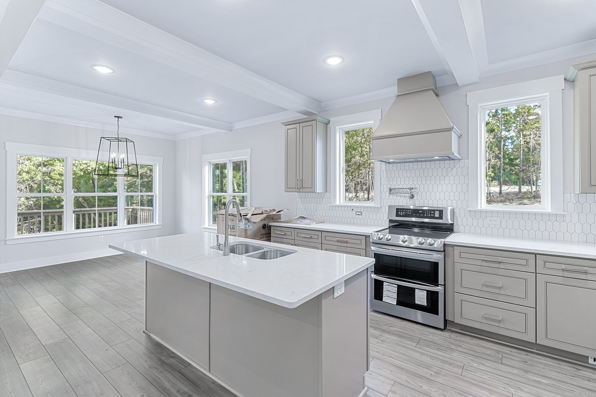 a kitchen with a large island and a stove .