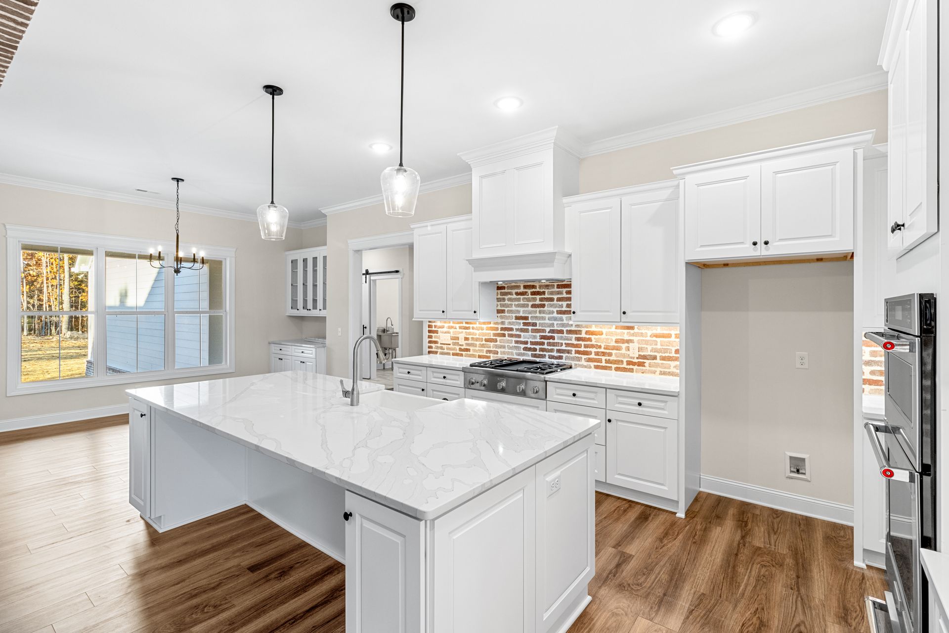 there is a large island in the middle of the kitchen .