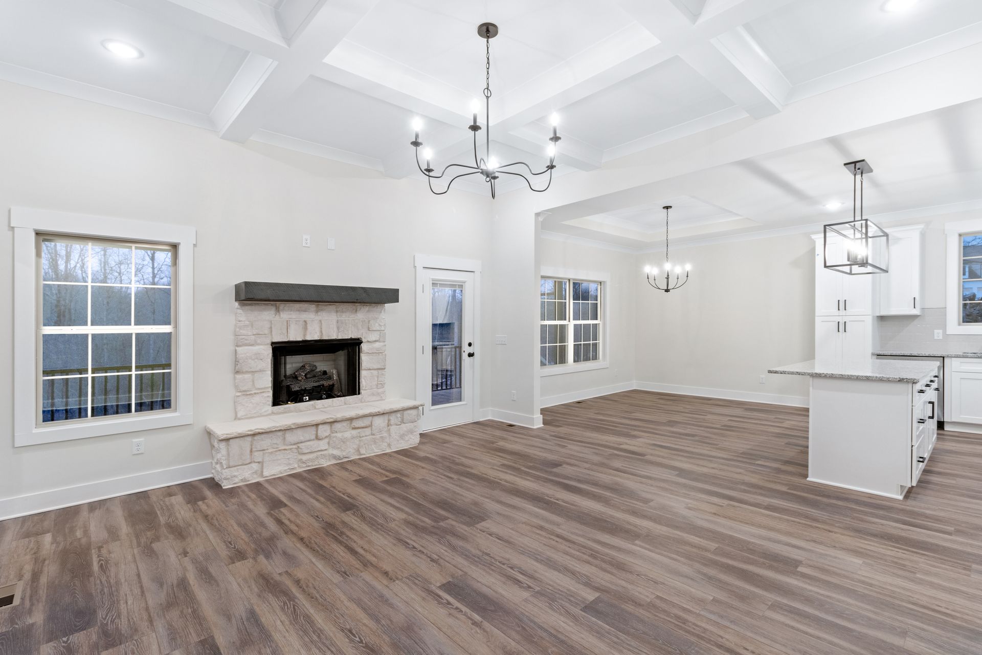 there is a fireplace in the middle of the living room .