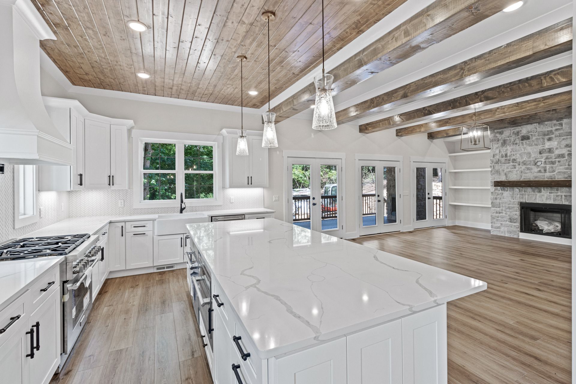 there is a large island in the middle of the kitchen .