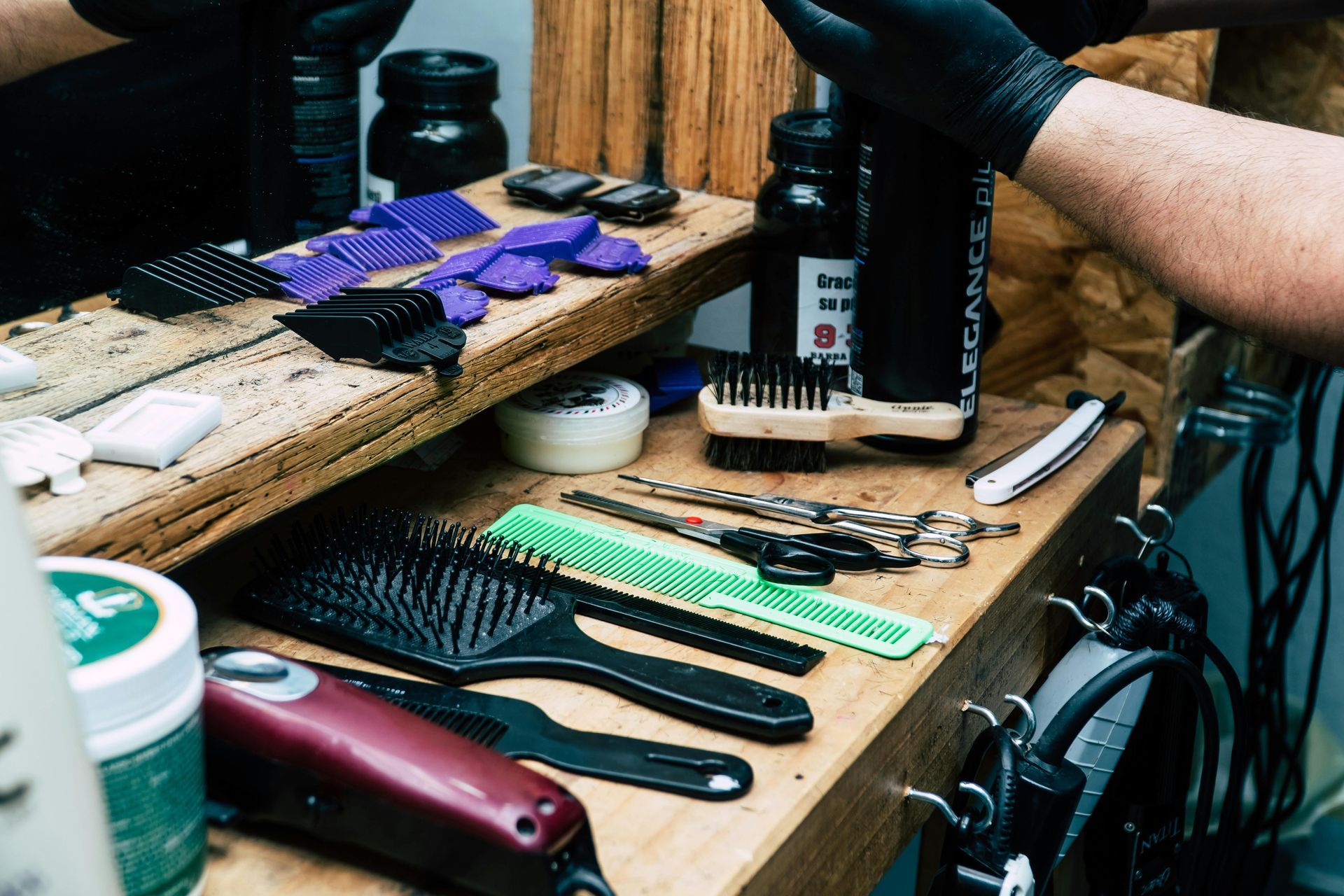 A man is getting his beard shaved by a barber.