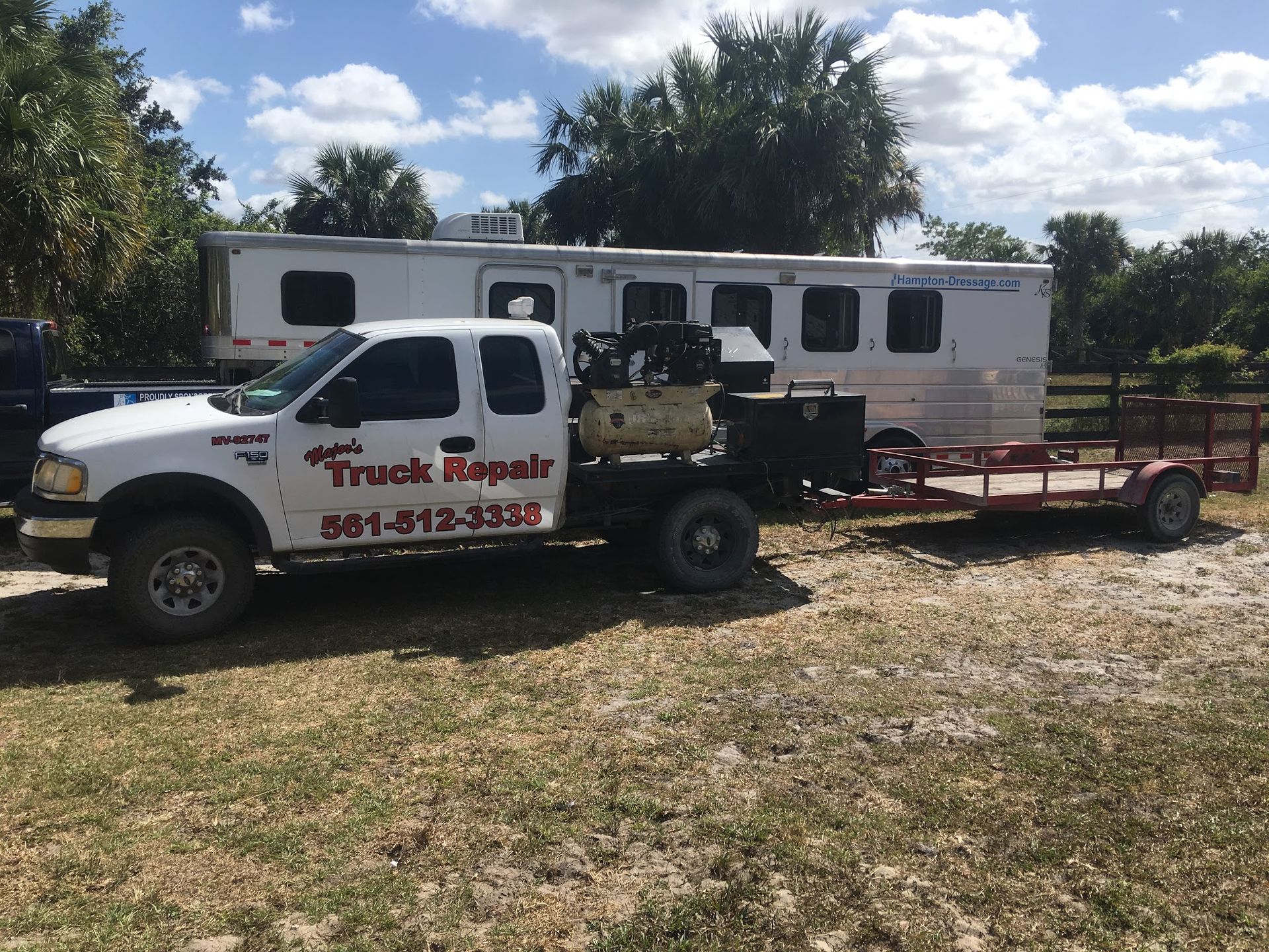 A large house with a lot of windows and a garage on a rainy day.