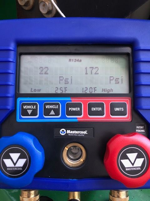 A/C diagnostic gauge showing pressures of 22 and 172 psi, and temperatures of 25F and 120F.