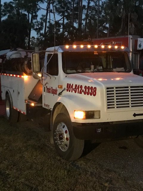 White work truck with lights on, 