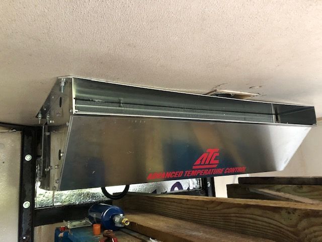 Metallic HVAC unit labeled 