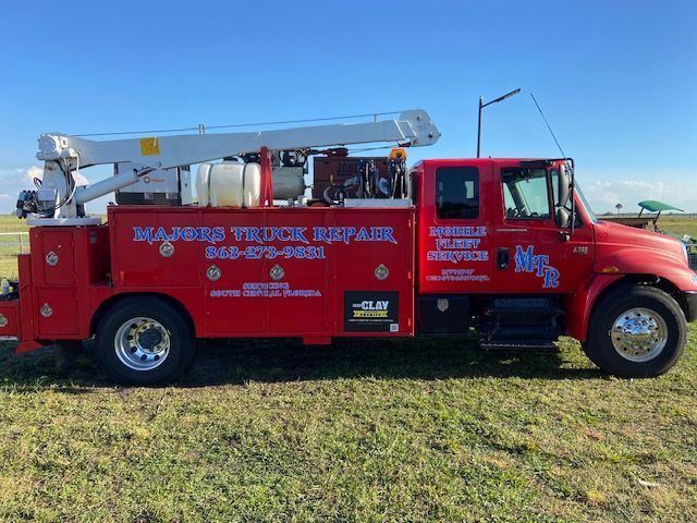 Red truck with a crane, 