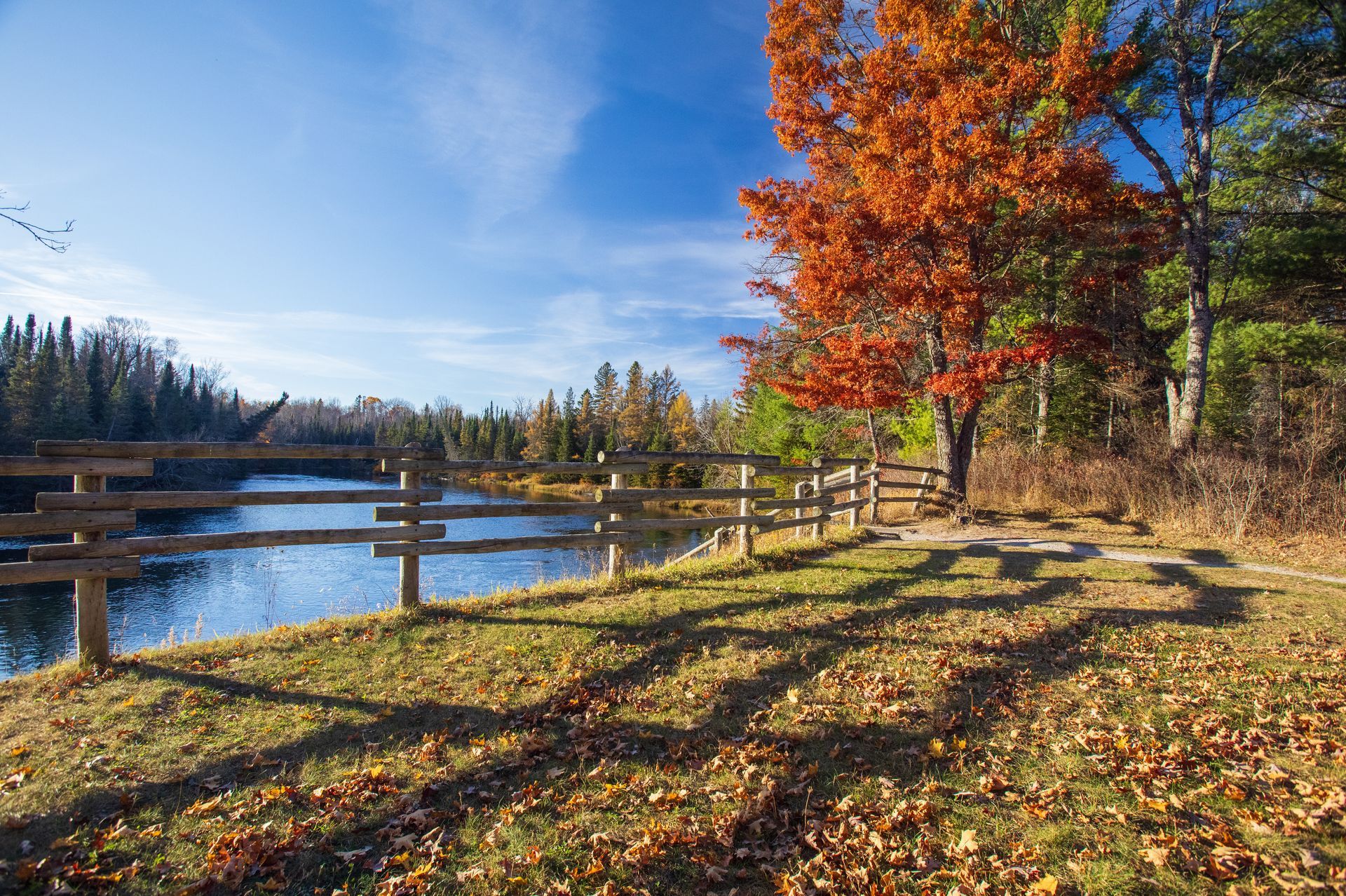 A sunset over a mountain range with a lot of fog