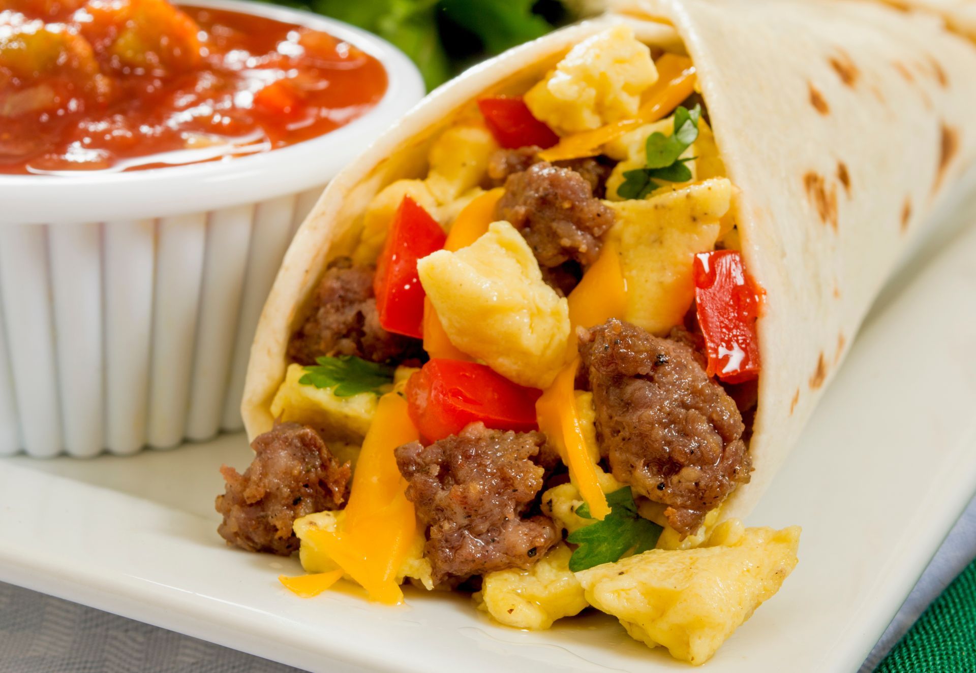 A sunset over a mountain range with a lot of fog