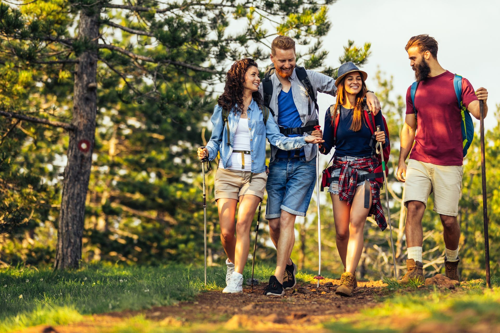 A group of young people are hiking in the woods.
