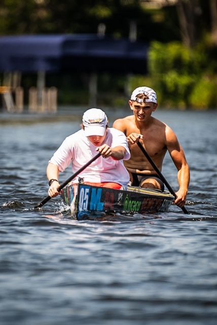 A sunset over a mountain range with a lot of fog