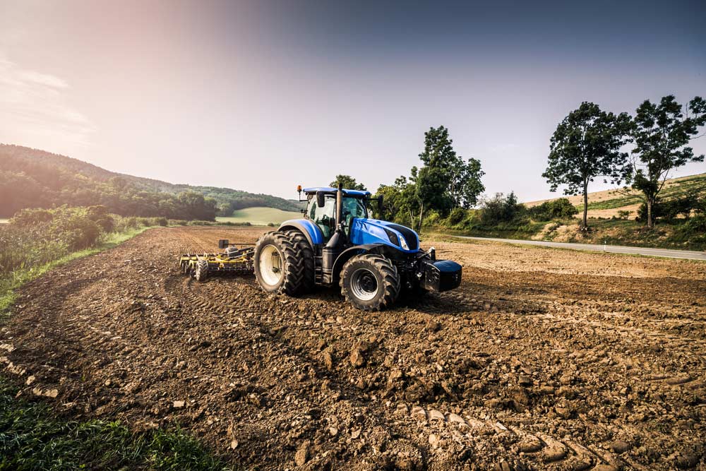 Cultivation After Harvest with Big Blue Modern Tractor — Diesel Fitter and Mechanic In Bundaberg East, QLD