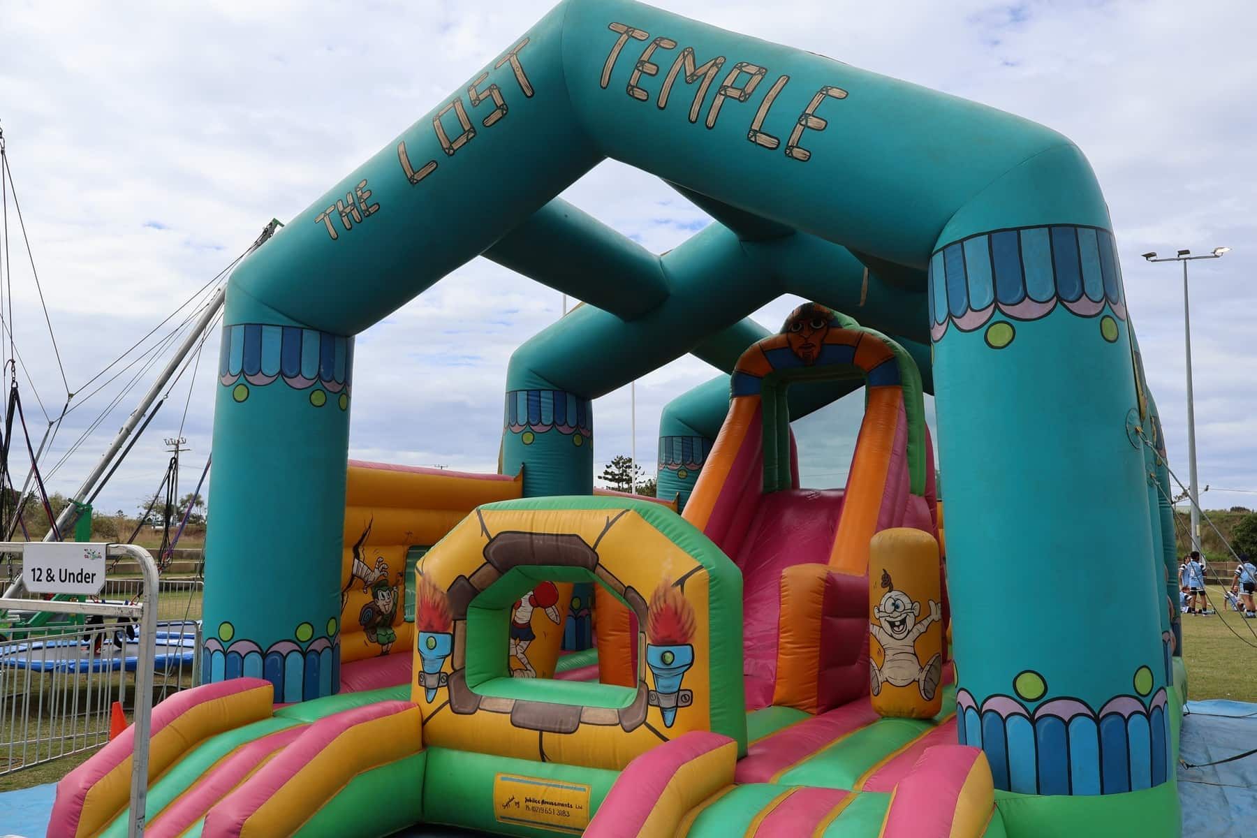 A Bouncy House With The Word Temple On It — Bills Amusements In Rockhampton, QLD