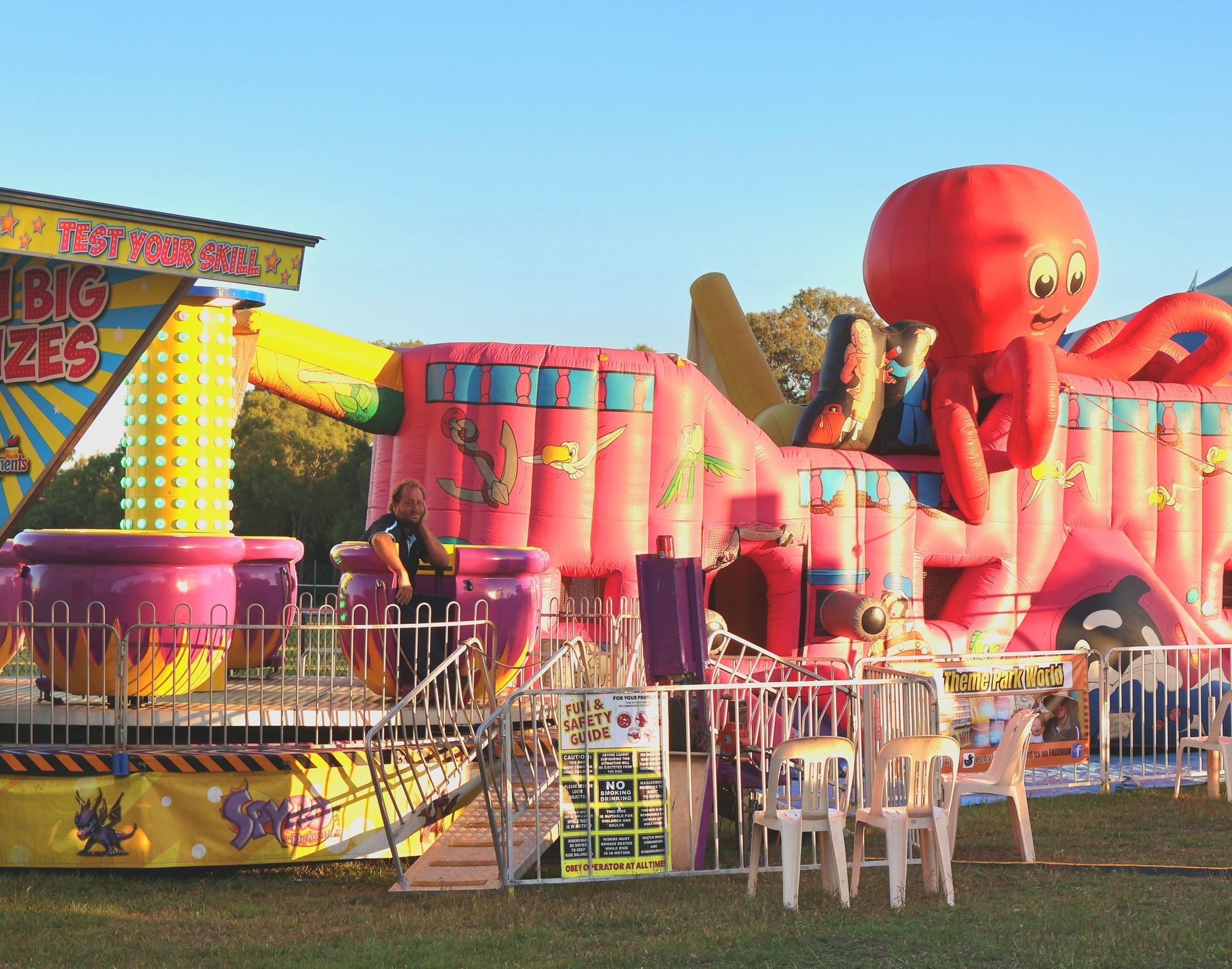 A Large Pink Jumping Castle And Teacup Ride — Bills Amusements In Rockhampton, QLD