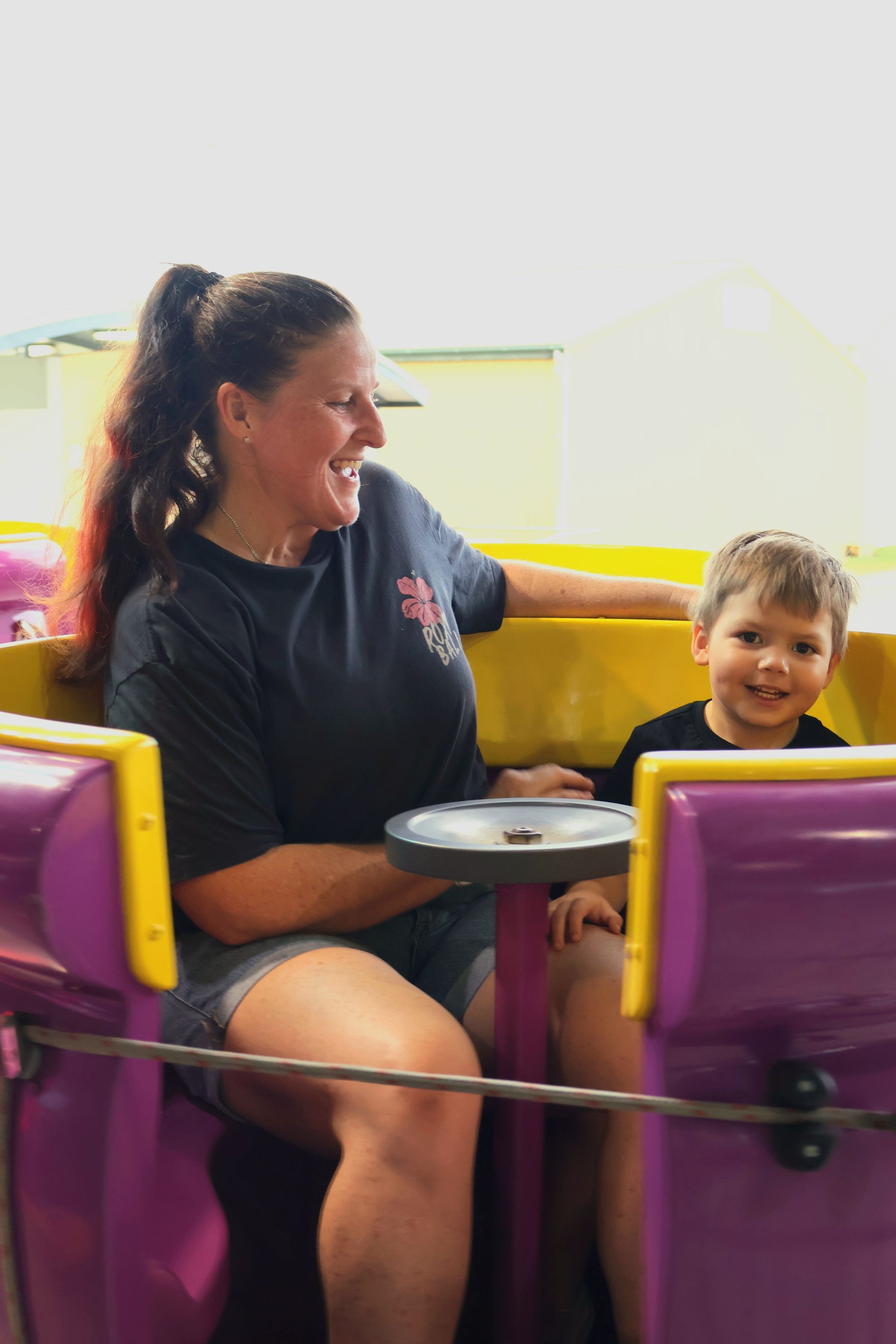 A Woman And A Child Are Riding A Roller Coaster — Bills Amusements In Rockhampton, QLD