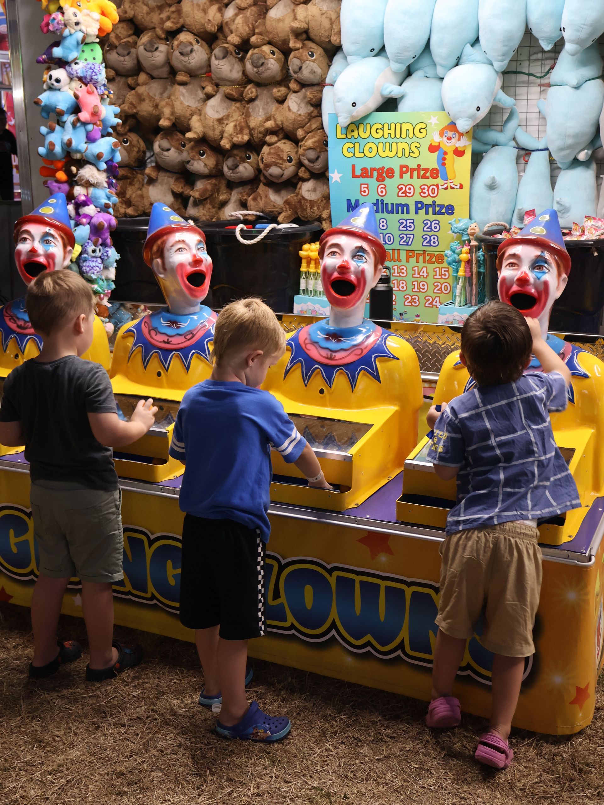 A Row Of Clown Heads With Their Mouths Open — Bills Amusements In Rockhampton, QLD