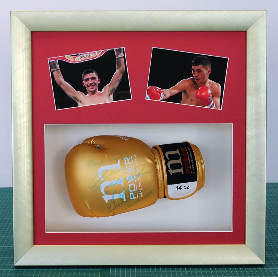 Boxing glove and photos framed