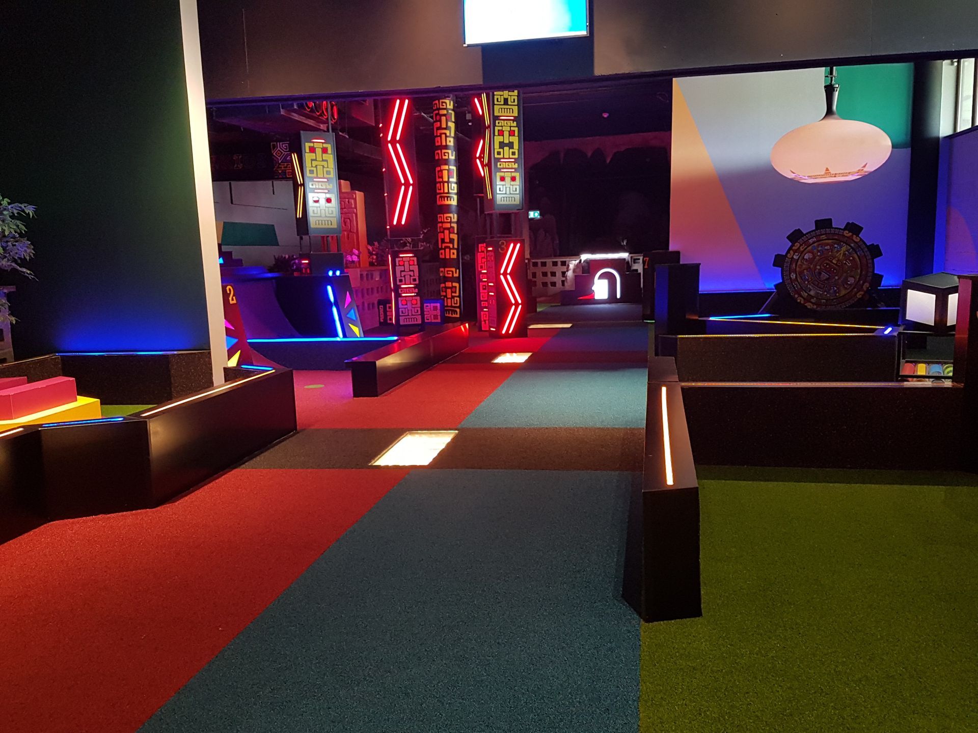 A colorful hallway with a sign that says ' escape ' on it