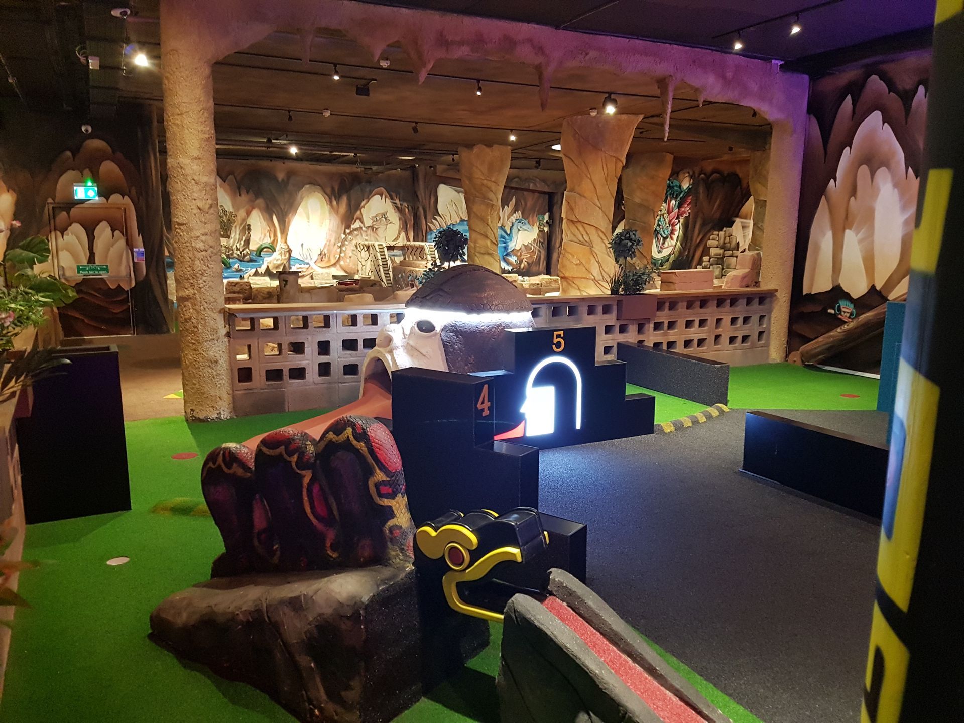 A mini golf course with a number 5 on it