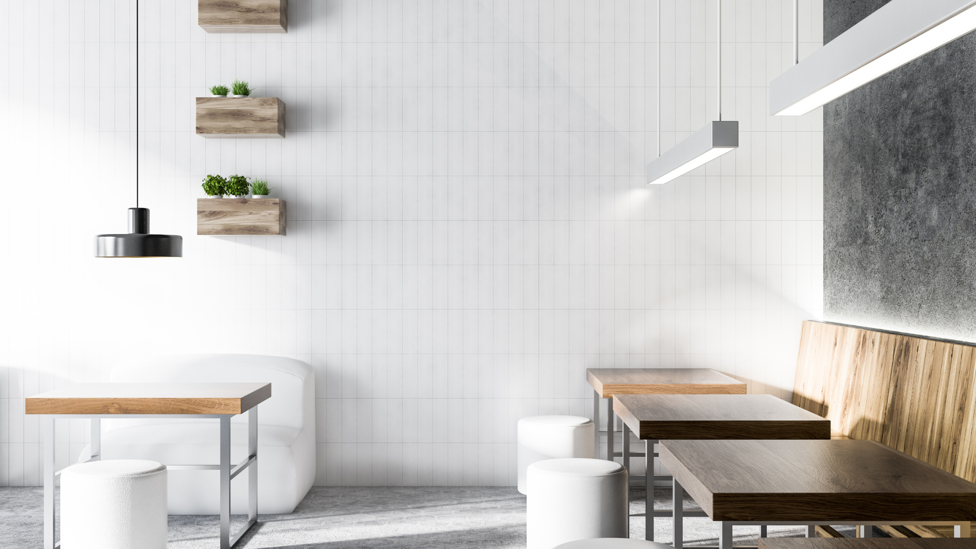 A restaurant with white tiles and wooden tables and chairs.
