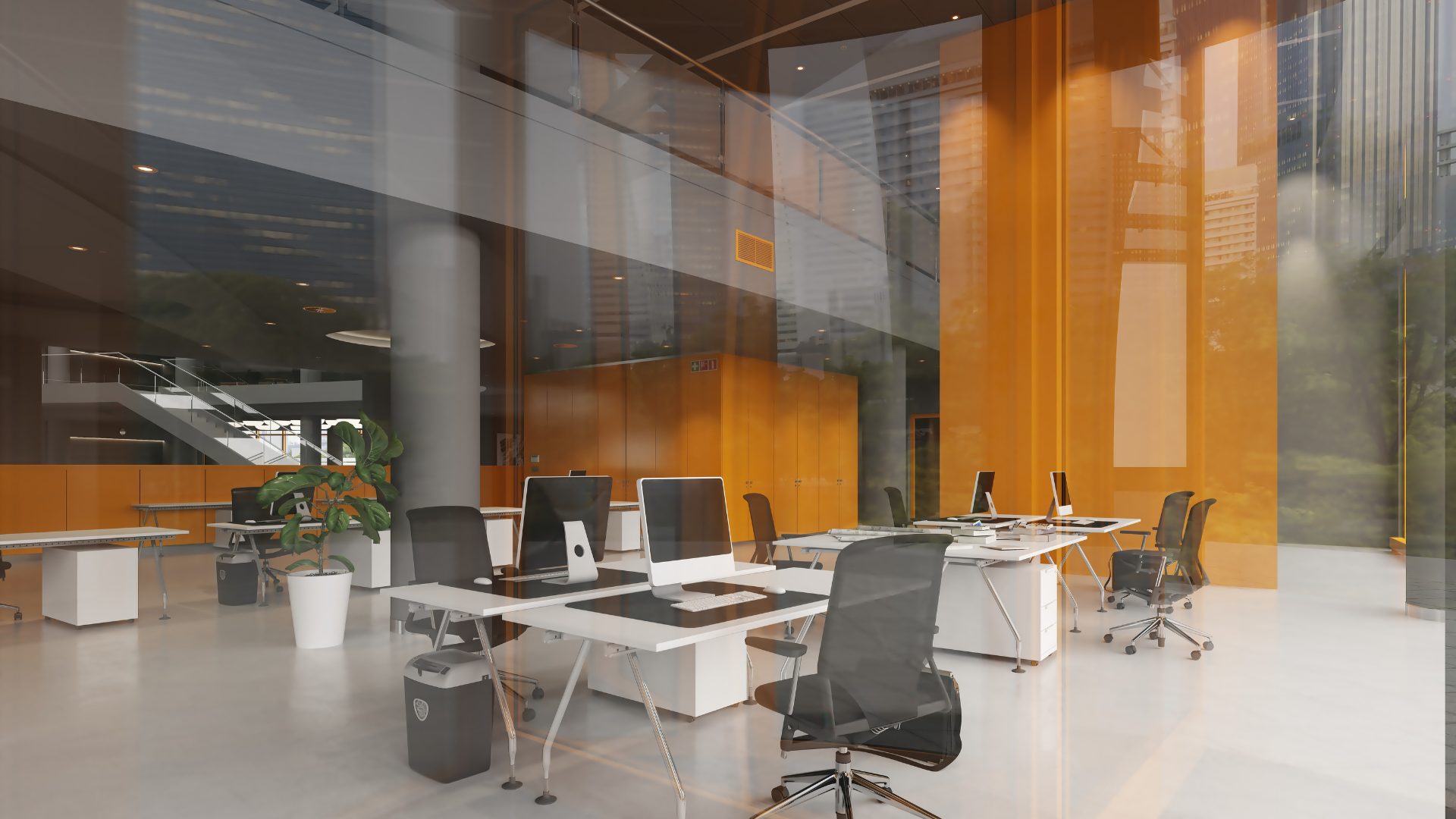 An empty office with a lot of desks and chairs.