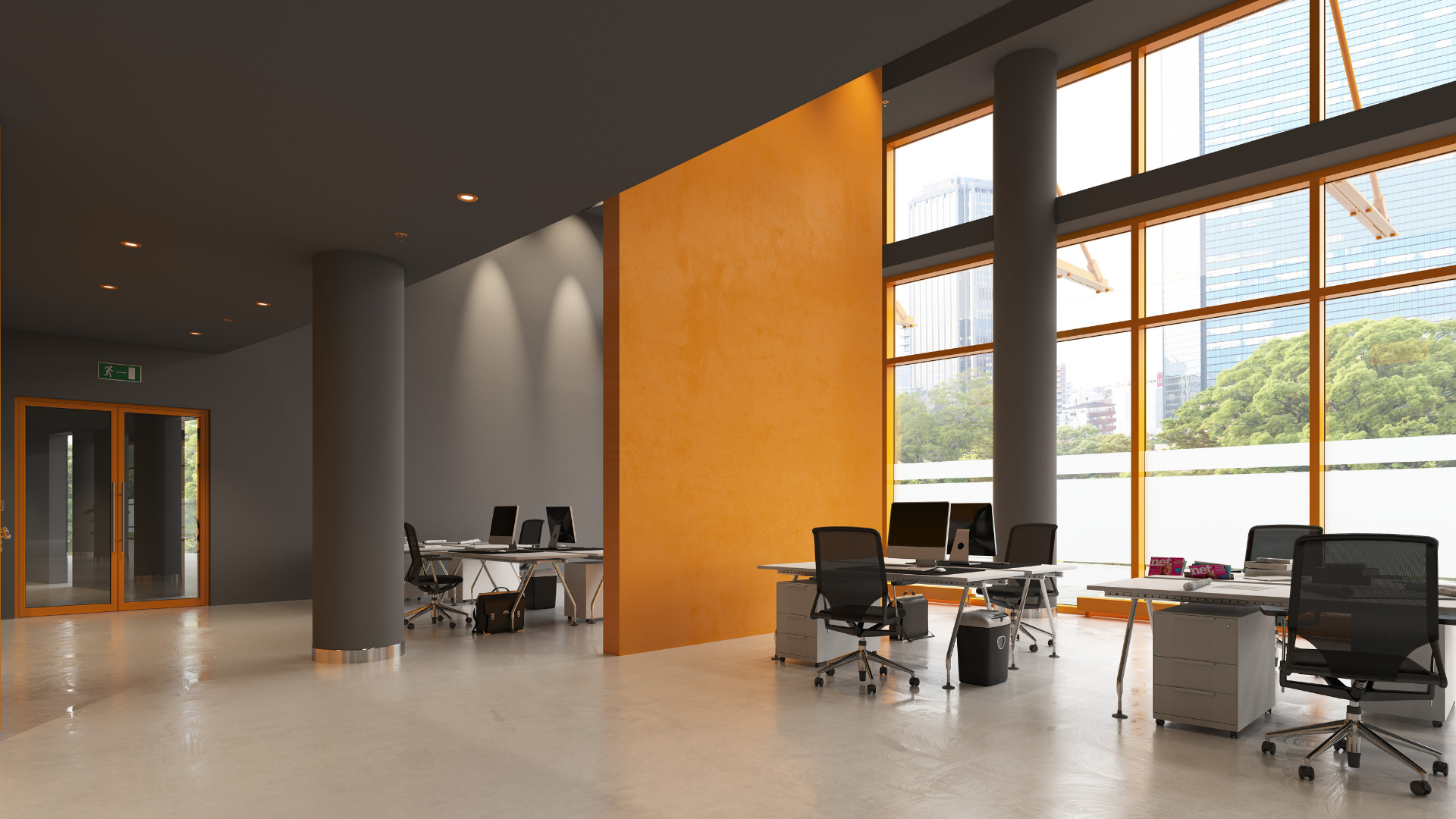 An empty office with orange walls and a lot of windows