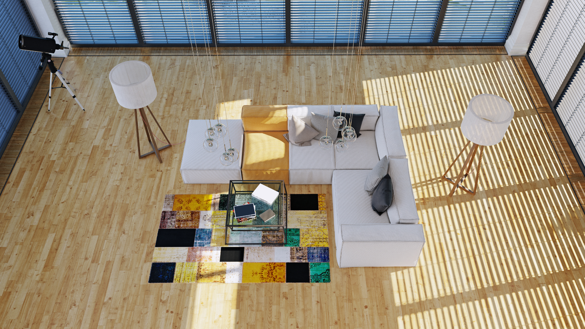 An aerial view of a living room with a couch and a rug.