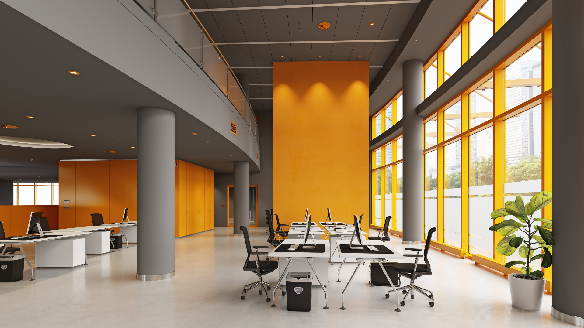 An office with orange walls and a lot of windows