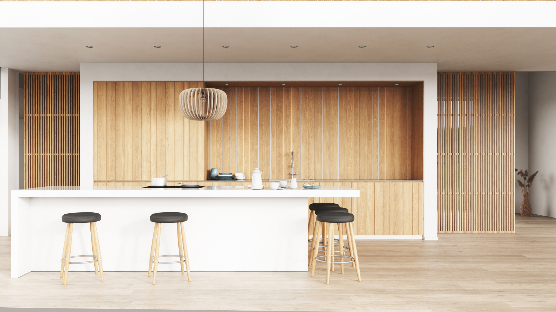 A modern kitchen with wooden cabinets and stools.