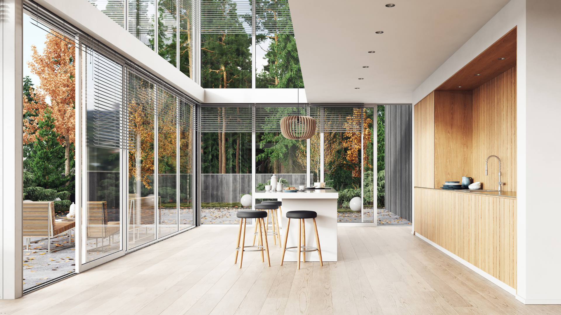 A modern kitchen with a large island and lots of windows.