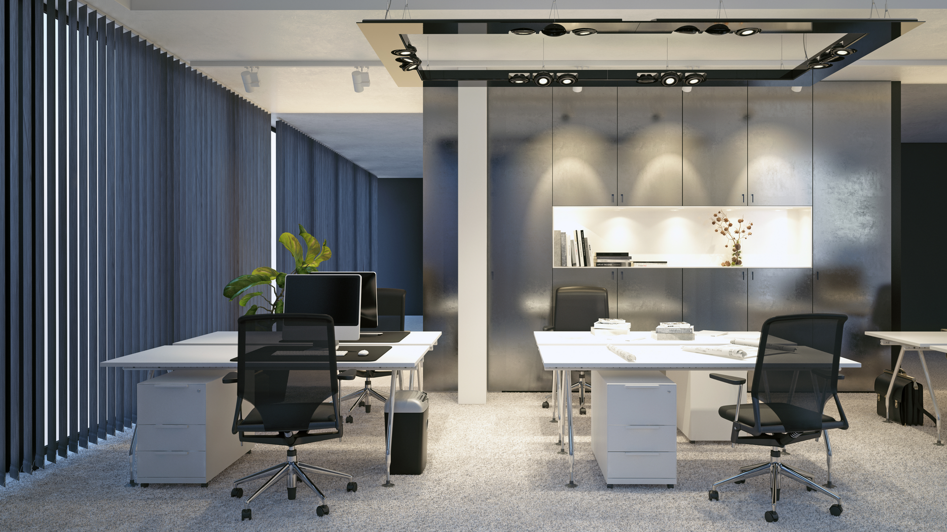 A modern office with a lot of desks and chairs.